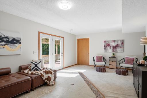 The door in the back leads to one of two lower level bedrooms.