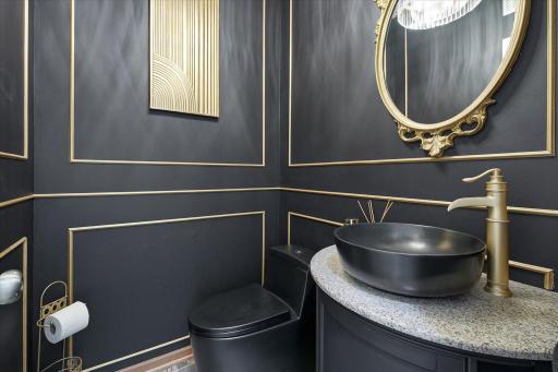 The 1/2 bath has been redone to make it deep & moody, and very impressive!