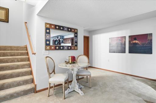 When you arrive downstairs, you are immediately greeted by neutral tones, and a large landing pad.