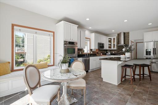 The kitchen also has a dinette area attached to it, with an adorable built-in bench!