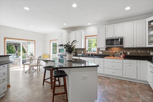 As we pass through the dining room into the kitchen, our jaws drop at how beautiful & spacious this kitchen is!