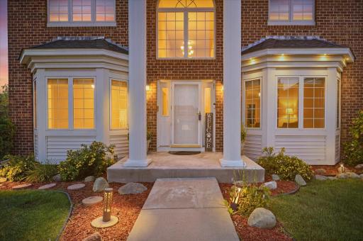 The landscaping is tasteful and low-maintenance. The columns add a touch of stately luxury. The bay windows add architectural texture. Wow.