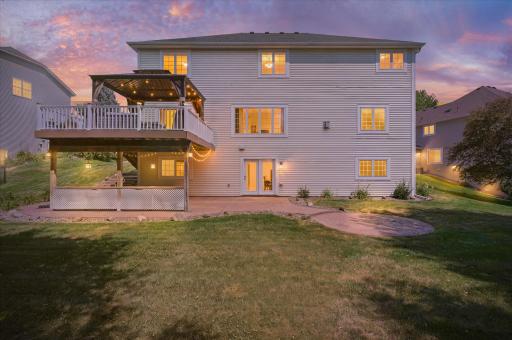 The back yard is large & flat, with a huge composite deck and an even huger (is that a word?) stamped concrete patio!