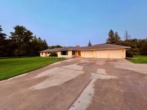 Attached 3 stall garage and large concrete apron