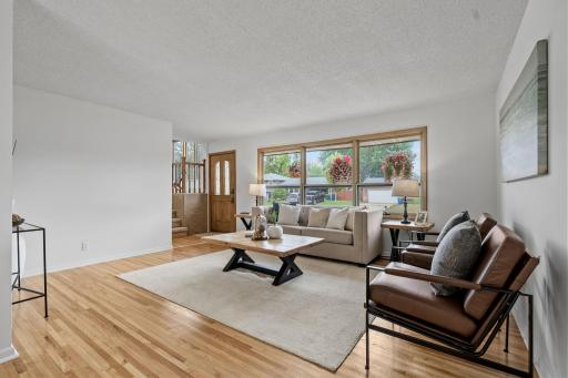 Spacious Family Room flows directly into the Kitchen + Informal Dining