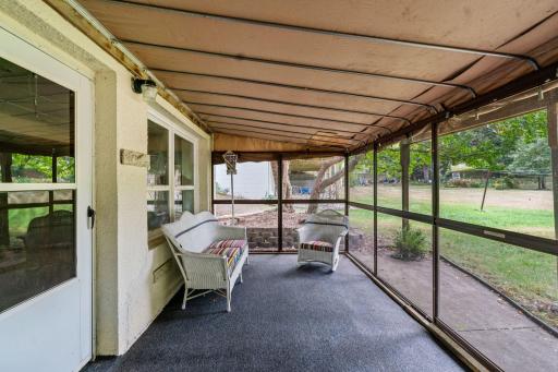 LL walk out to a screened porch overlooking amazing backyard.