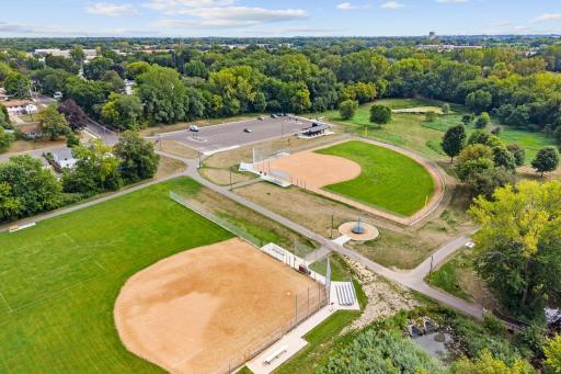 Located minutes from Hansen Park w/ tennis courts, ballfields, playground, lighted trails + 12-hole disc golf course.