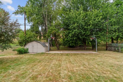 Concrete sport court/basketball court ideal for recreation + entertaining