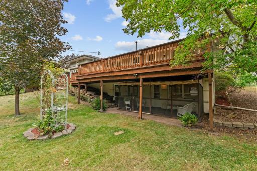 LL walk out to a screened porch overlooking amazing backyard.