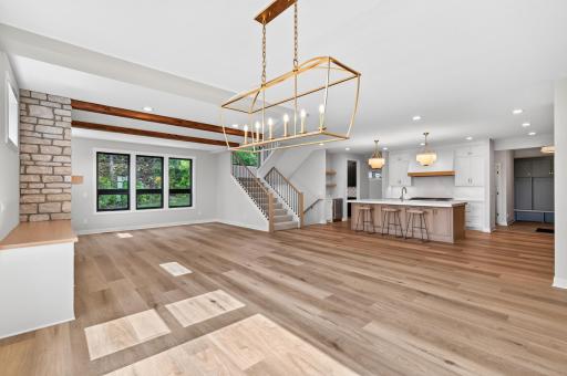 Open concept kitchen, dining, and living room areas