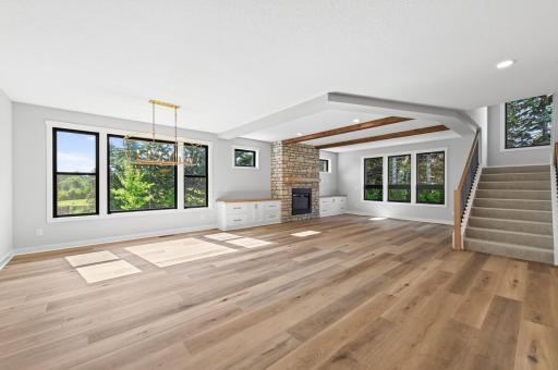 Open concept kitchen, dining, and living room areas
