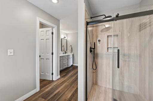 View of the walk in shower in the primary bath.