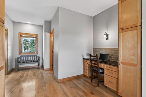 Stay organized with this built in desk, right off the kitchen.