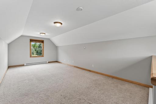 Bonus room above the garage with zoned heating.