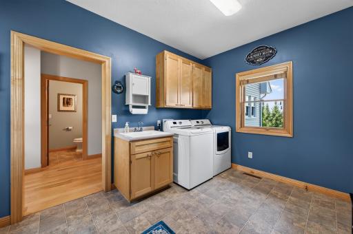 Main level laundry room with utility sink