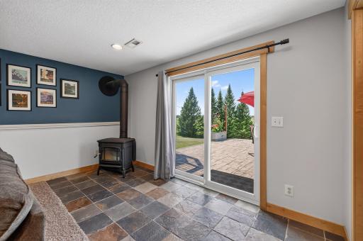 Wood burning stove and walk out to the lower level patio space.
