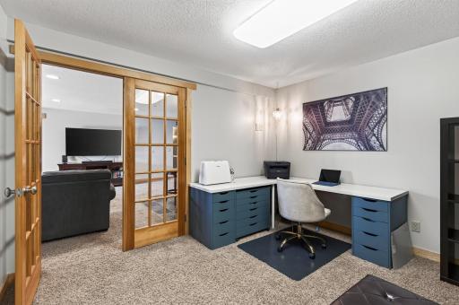 Office space features french doors.