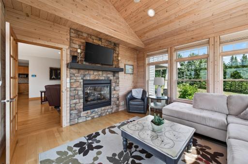 Double sided gas fireplace shared by main level living room.