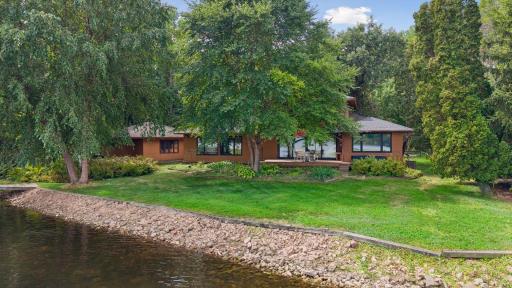 Expansive 150'+ of shoreline offers beautiful lake views from nearly every room