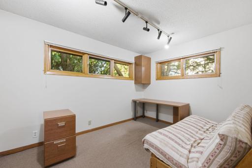 Add egress windows to this main level office with walk-in closet to create a third bedroom!