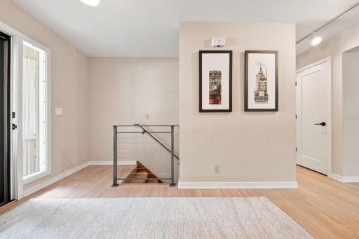 All railings (inside and outside) were replaced with contemporary steel or steel cable railings.