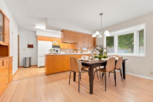 The spacious dining room flows into the kitchen.