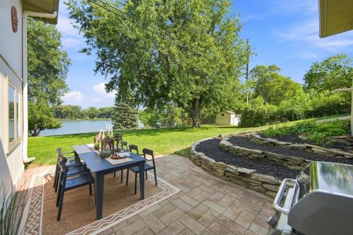 Enjoy 94 feet of lakeshore & panoramic views from this walk-out rambler.
