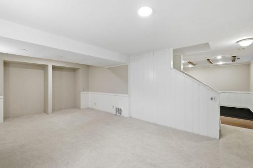 family room with staircase up to the first floor