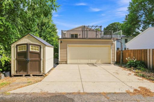 two car attached garage with spacious deck above