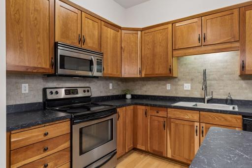 Stainless stel appliances and tile backsplash