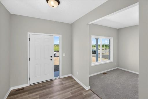 PHOTO OF A DIFFERENT HOME WITH SIMILAR PLAN AND FINISHES.