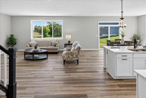 PHOTO OF A DIFFERENT HOME WITH SIMILAR PLAN AND FINISHES.