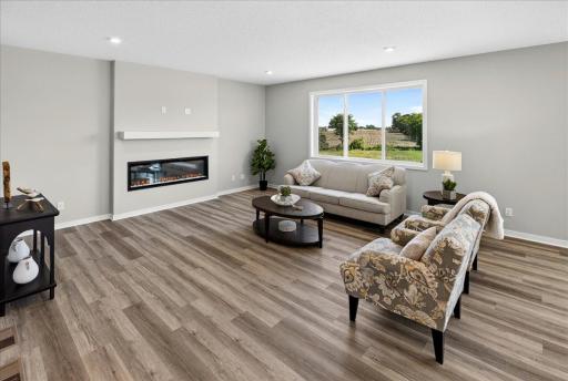 PHOTO OF A DIFFERENT HOME WITH SIMILAR PLAN AND FINISHES.