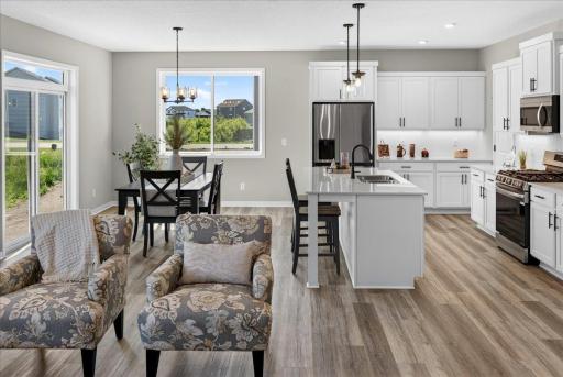 PHOTO OF A DIFFERENT HOME WITH SIMILAR PLAN AND FINISHES.