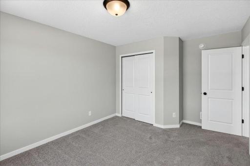 PHOTO OF A DIFFERENT HOME WITH SIMILAR PLAN AND FINISHES. Bedroom 3.