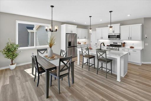 PHOTO OF A DIFFERENT HOME WITH SIMILAR PLAN AND FINISHES.