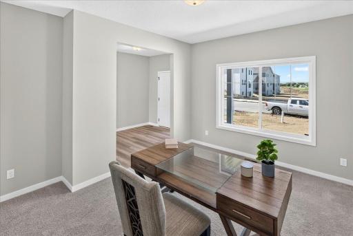 PHOTO OF A DIFFERENT HOME WITH SIMILAR PLAN AND FINISHES.