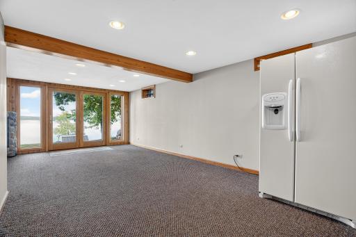 Extra refrigerator is included. This room can be used as a game room, an extra guest or multi-generational space