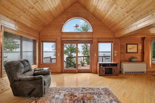 New Marvin atrium door system takes you out to the deck to enjoy your morning coffee. Maple Hardwood Floors.