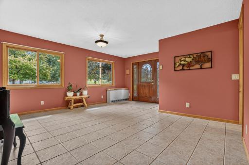 This tile floor room off the front entry offers many uses depending on your needs. Has been a mud room, a music room, another dining room, etc.