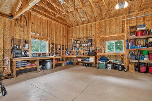 Another angle of the garage with built in work benches.