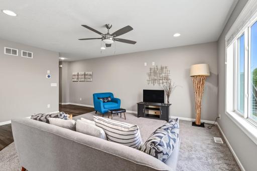 Main level living room with space for furniture and tv
