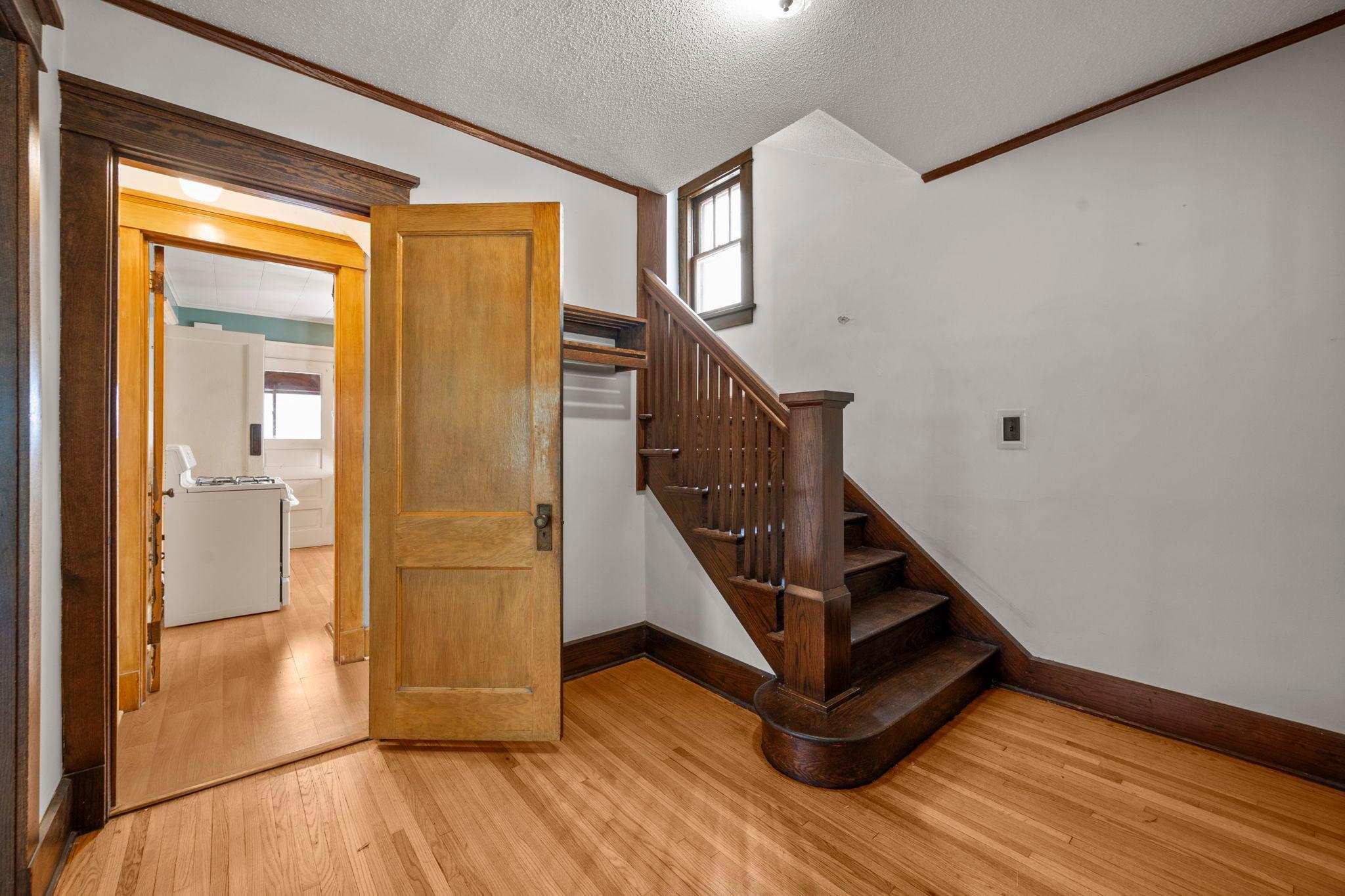 Formal front entry with beautiful woodwork set the tone for this home's timeless charachter
