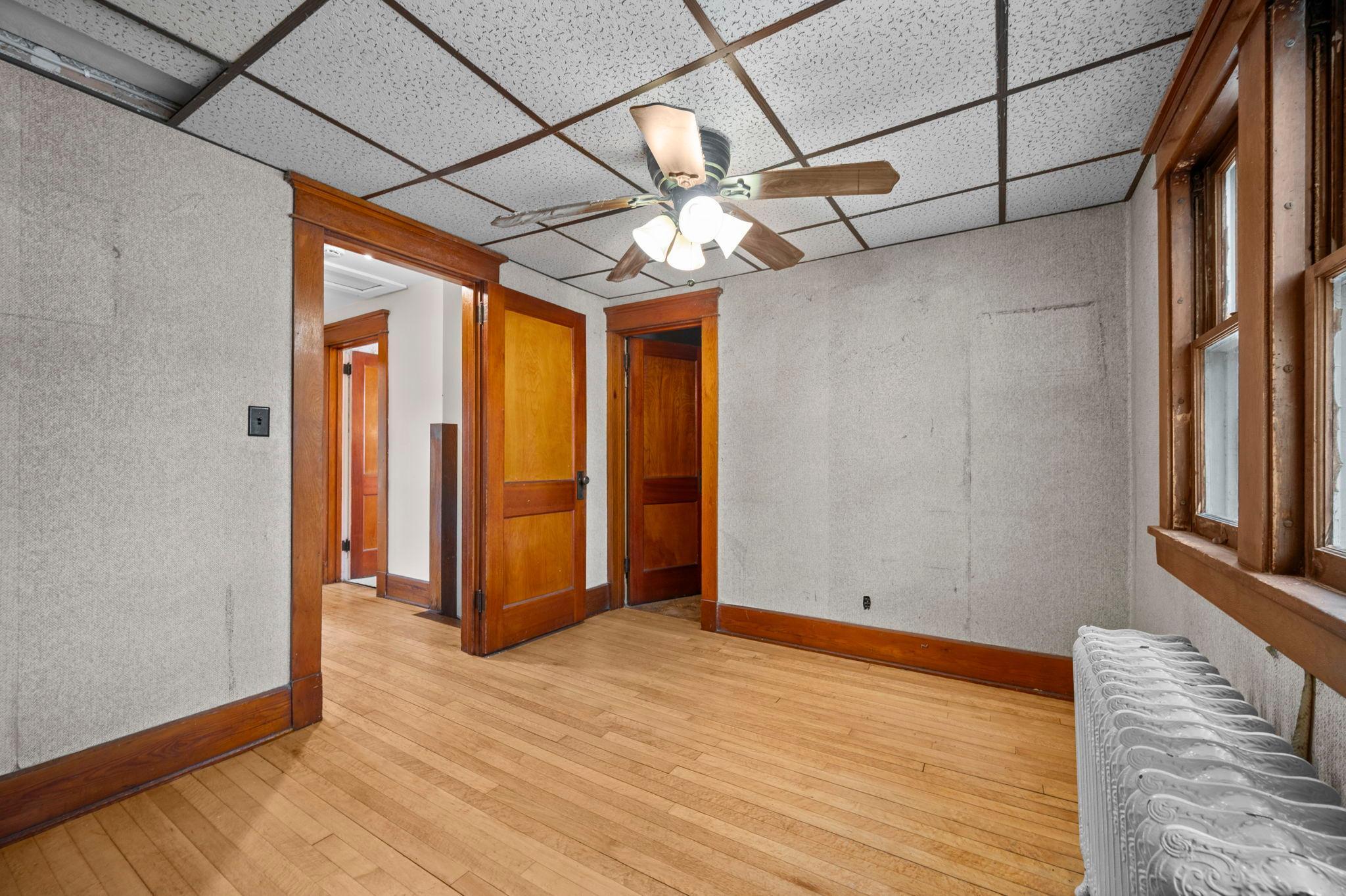 Front bedroom features original trim and large closet.