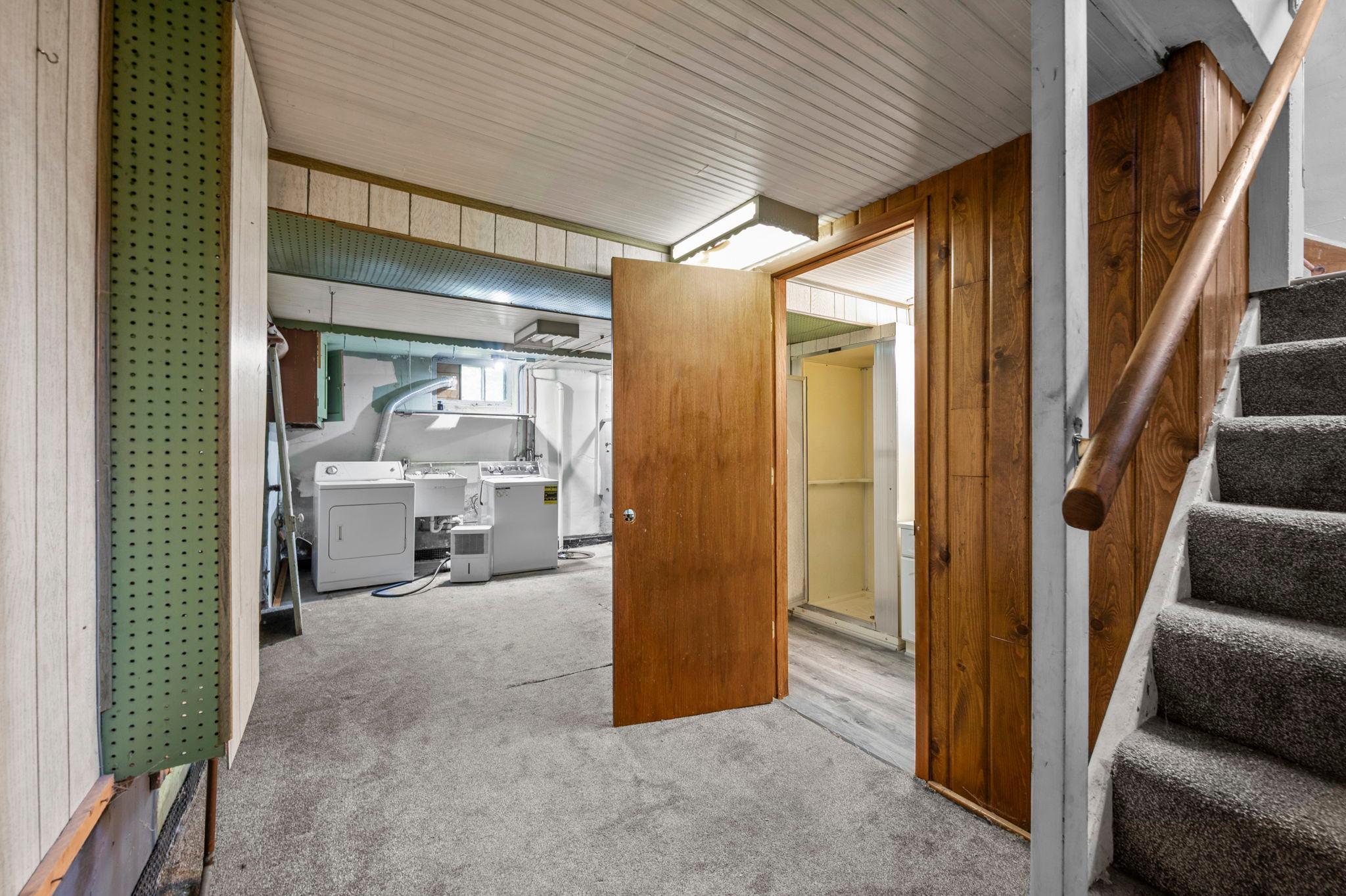 Drain-tiled lower level with washer/dryer hookups and a utility sink offers everyday function and peace of mind.