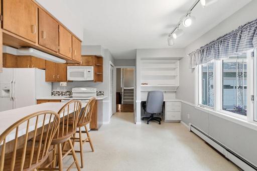 Kitchen also features built-in desk area & overlooks front yard/driveway