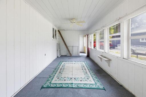Side porch off Kitchen with access to driveway/front of house
