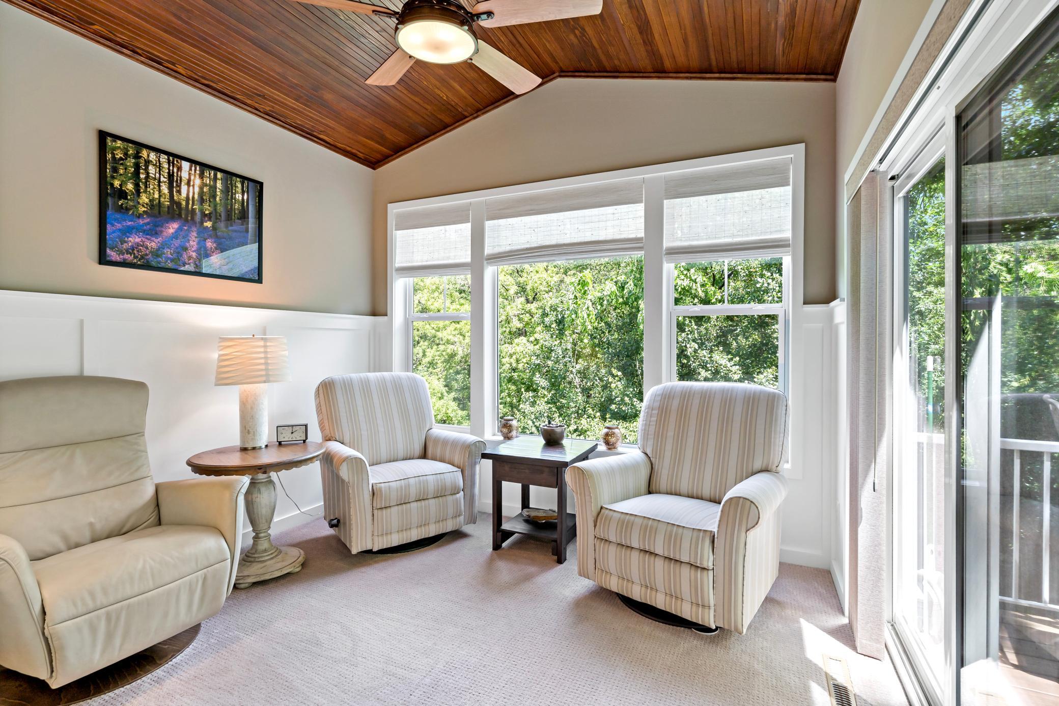 A favorite room in the home is this stunning sunroom with vaulted ceiling and access to the deck.