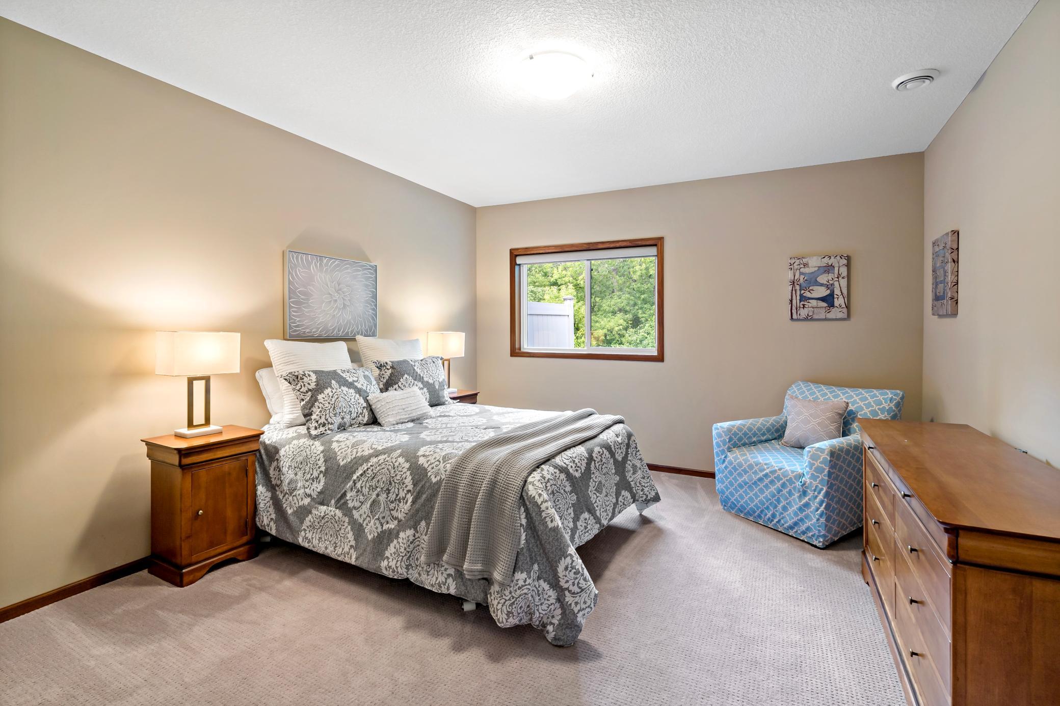 The third bedroom is located on the lower level and offers another large walk in closet as well as view of the wooded back yard.