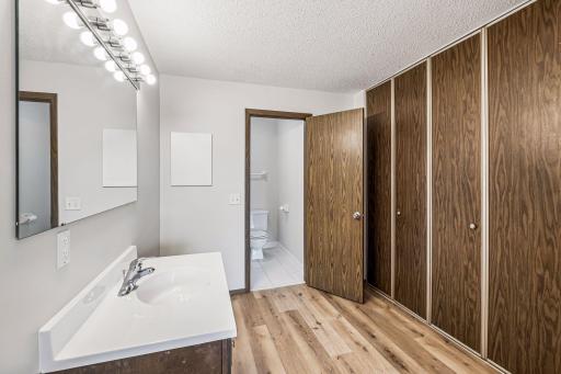 A huge wall of closets in the primary bedroom suite